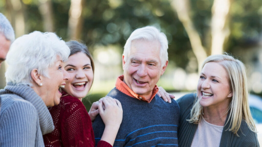 An older couple laughing with their adult children, the families an estate planning attorney in Calabasas serves
