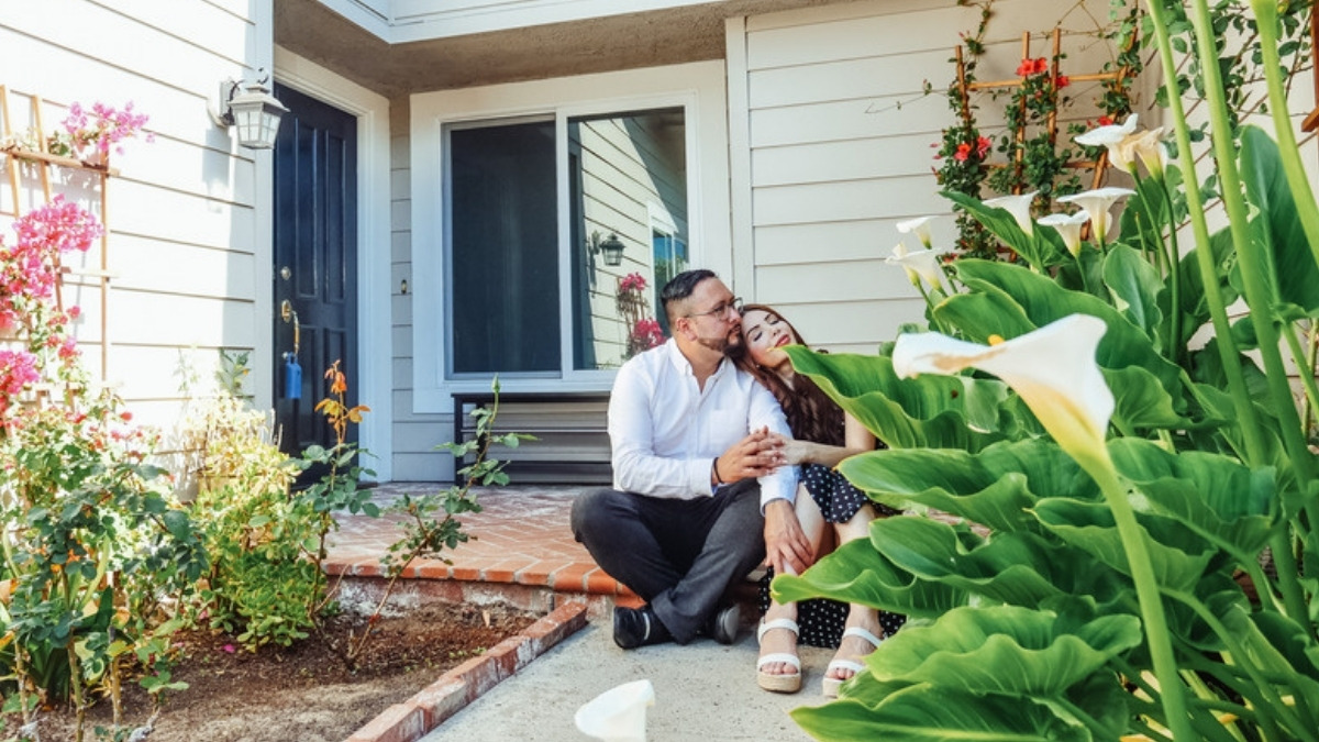 A couple outside one of the properties an estate planning attorney in Encino reviews for title