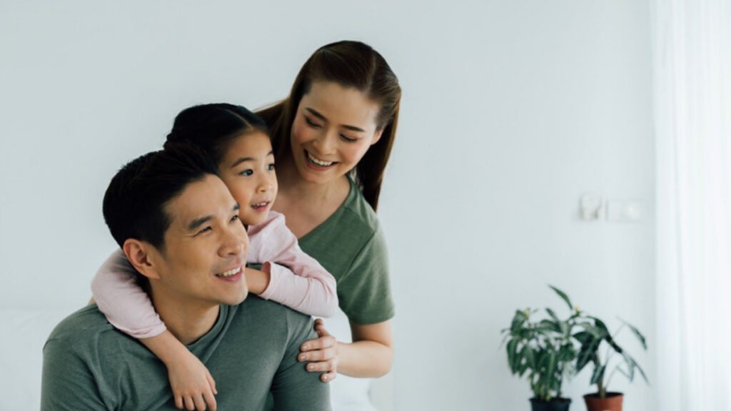 Parents at home with their young child
