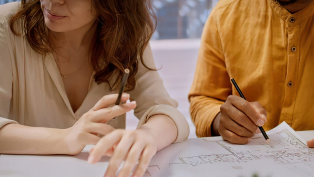 A couple signing their plan after meeting a Camarillo estate planning attorney