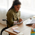 A young adult with a disability at work, whose family meets with a Camarillo limited conservatorship attorney