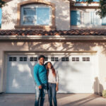 A couple outside the home their Camarillo living trust attorney will transfer into the trust