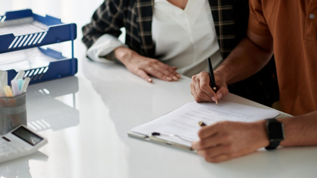 A couple signing the trust their Camarillo living trust attorney prepared