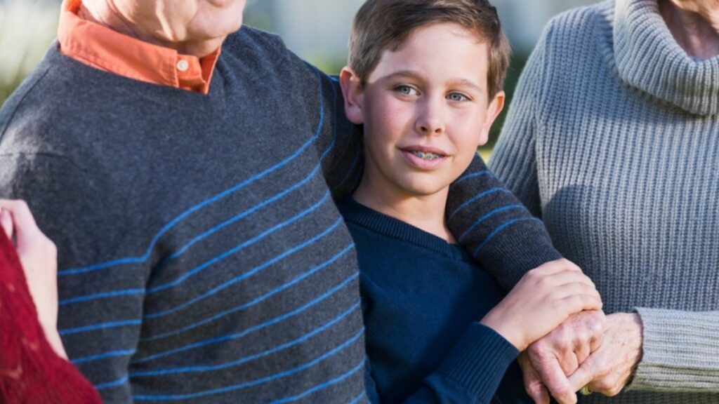 A teenage boy with his grandparents, who ask estate planning and trust attorneys in Los Angeles County how to leave him money