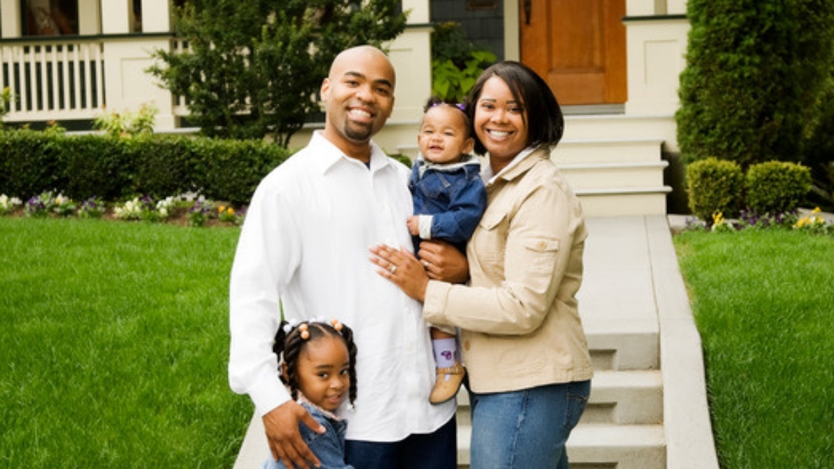A family outside their house, the households a special needs trust attorney in Newbury Park works with
