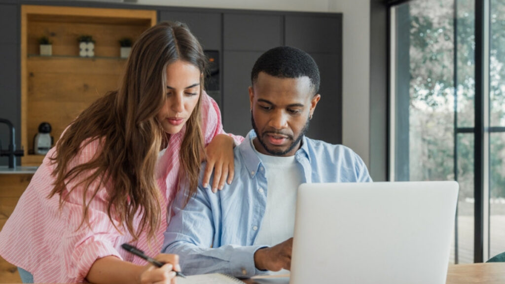 A couple working through documents before meeting an estate planning lawyer in Oxnard
