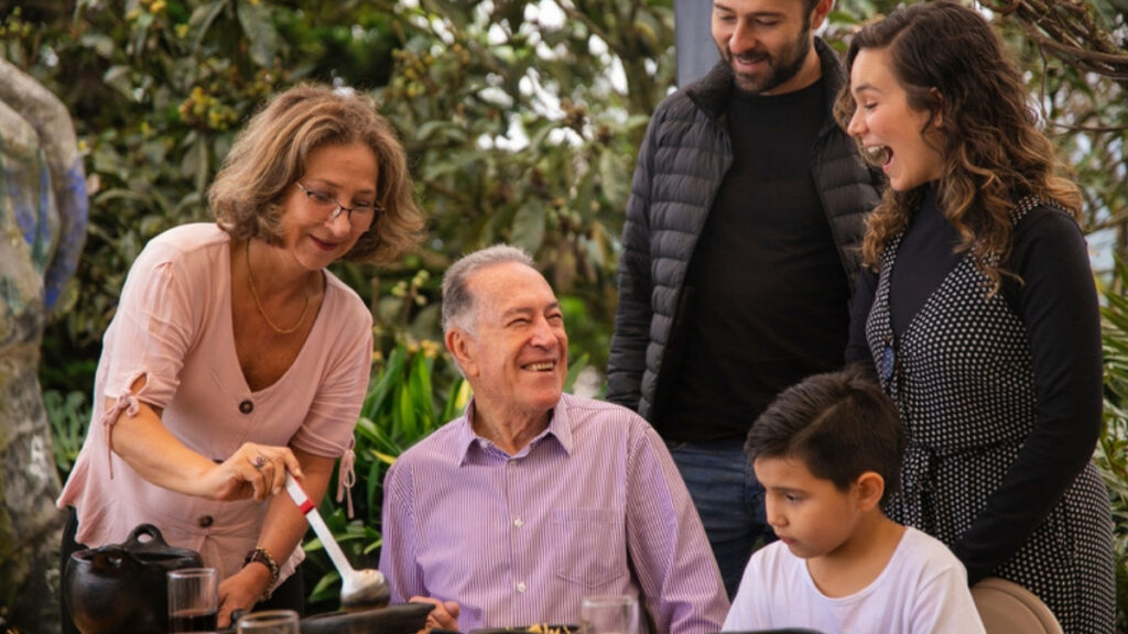 Three generations at an outdoor table, the families an estate planning lawyer in Santa Paula plans for