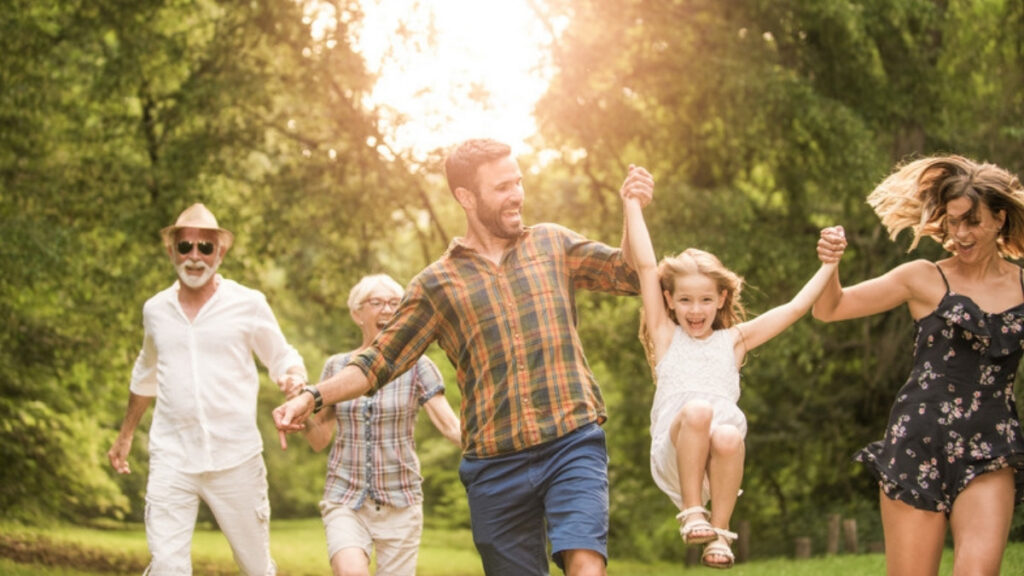 A family in a park, the parents who name guardians with an estate planning lawyer in Simi Valley