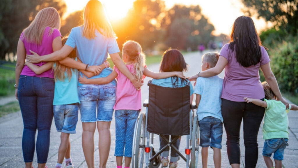 A support worker helping a young person with a disability