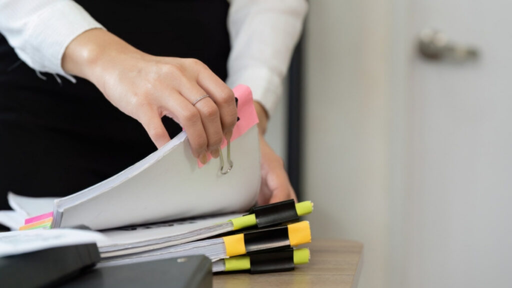 Financial records and folders organised on a desk
