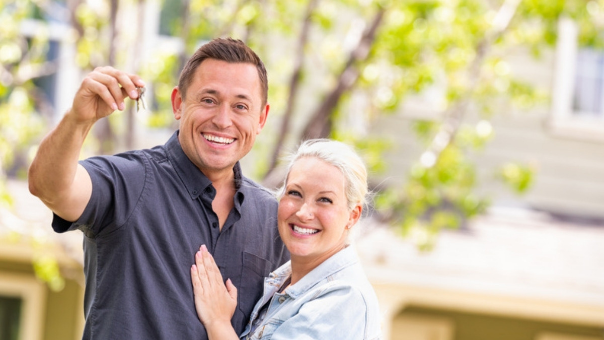 A couple outside their home, the homeowners an estate planning lawyer in Studio City advises