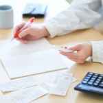 Trust paperwork and a calculator on the desk of a Camarillo trust administration attorney