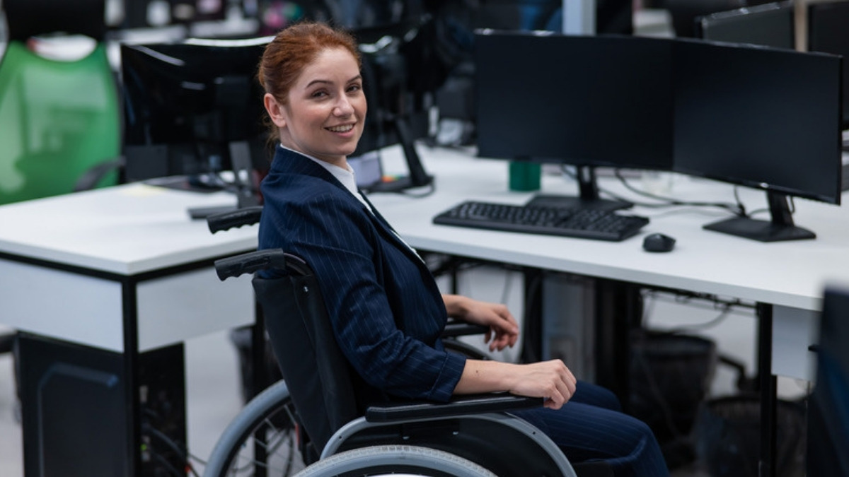 A young woman who uses a wheelchair at work, the independence a Camarillo special needs attorney plans for