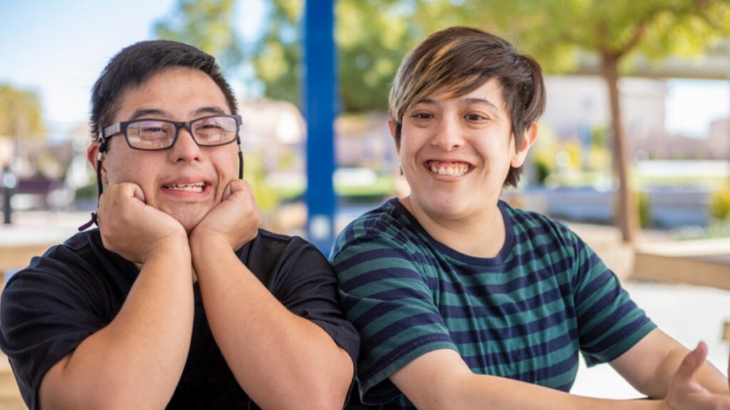 Two young adults outdoors, the age when families call a Camarillo special needs attorney