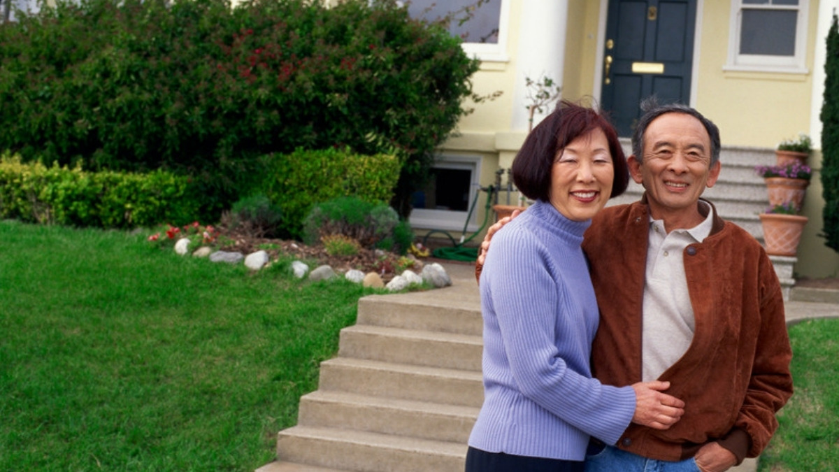 An older couple outside the home an estate planning lawyer in Van Nuys helps keep out of probate