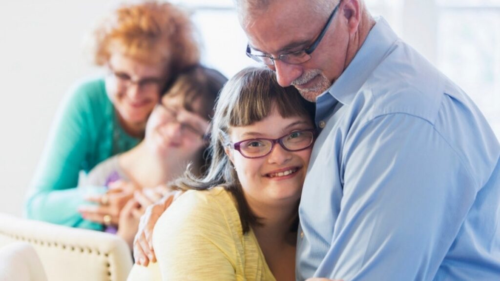 A father hugging his daughter who has Down syndrome, a family estate planning and trust attorneys in Ventura County plan with