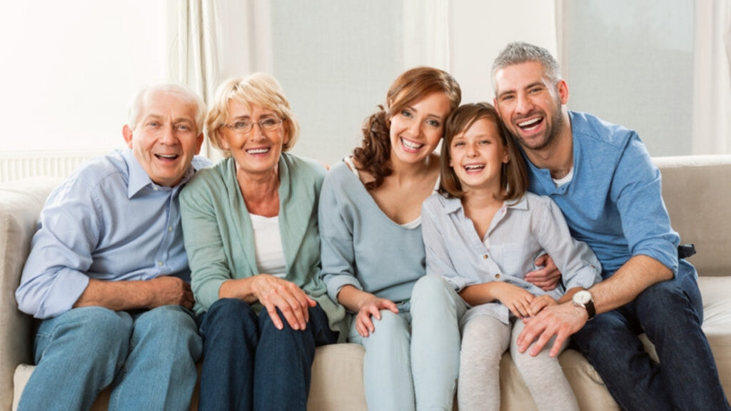Three generations on a sofa, the beneficiaries an estate planning lawyer in Woodland Hills helps name